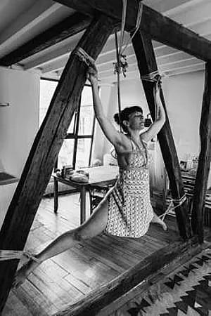 Tied to the beams gives her a sense of weightlessness.'