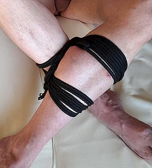 Black rope keeps legs crossed'