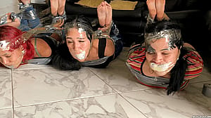 Six girls hogtied together (socks in their mouths)'